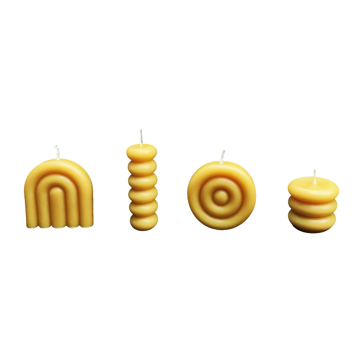 Complete Donut Beeswax Candle Collection, set of four, on a white background.
