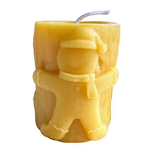Gingerbread Man Pillar Beeswax Candle on a pure white background