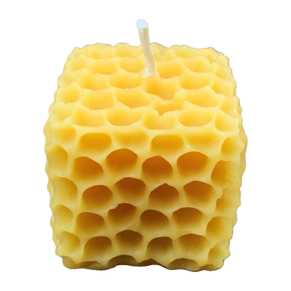 Honeycomb Cube Beeswax Candle on a pure white background
