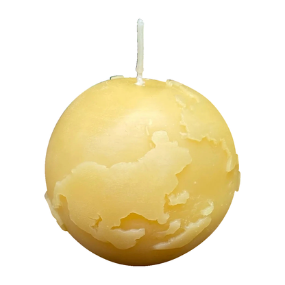 World Globe Beeswax Candle on a white background.