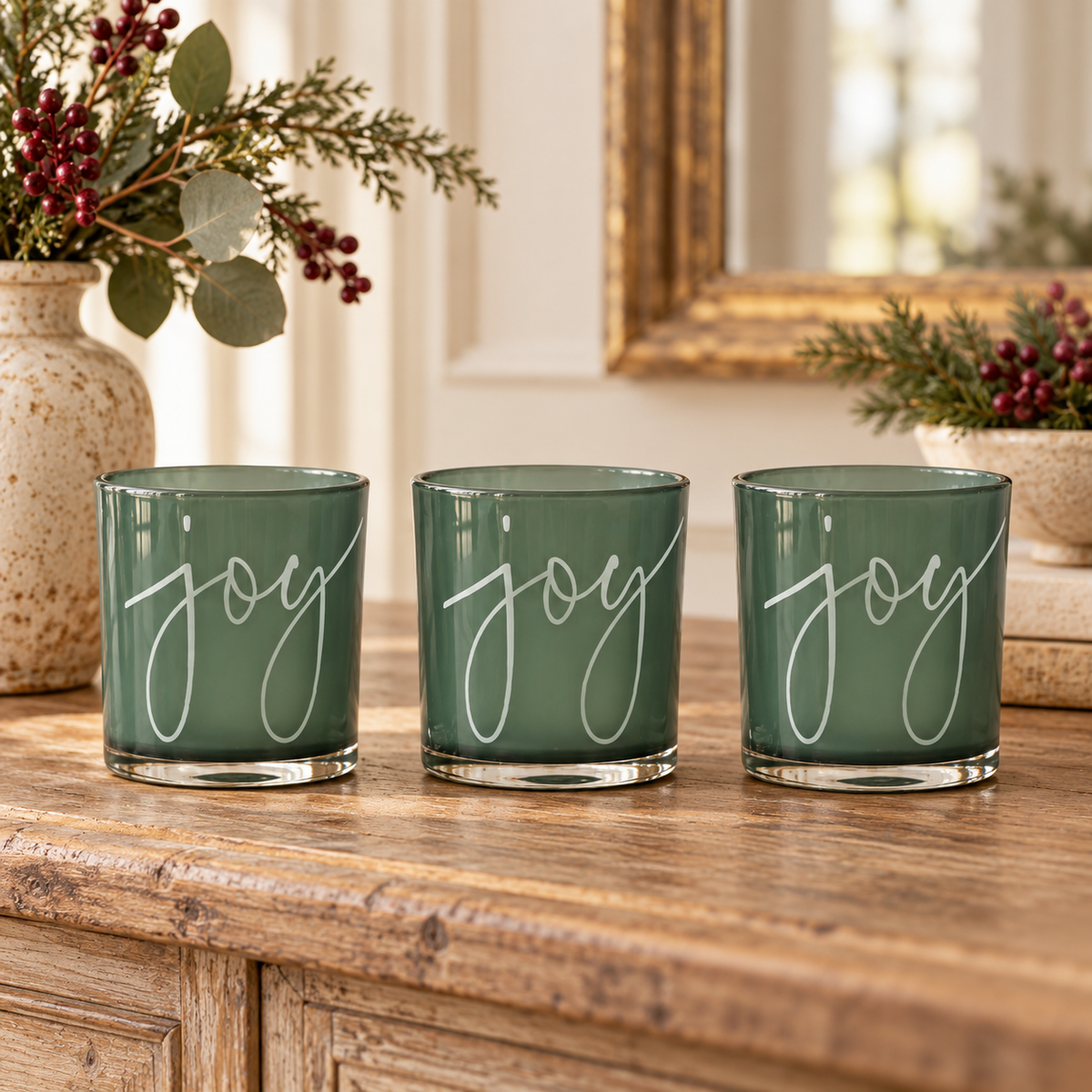 Green Glass Joy Candle Holder (Set of 3) in a styled home setting