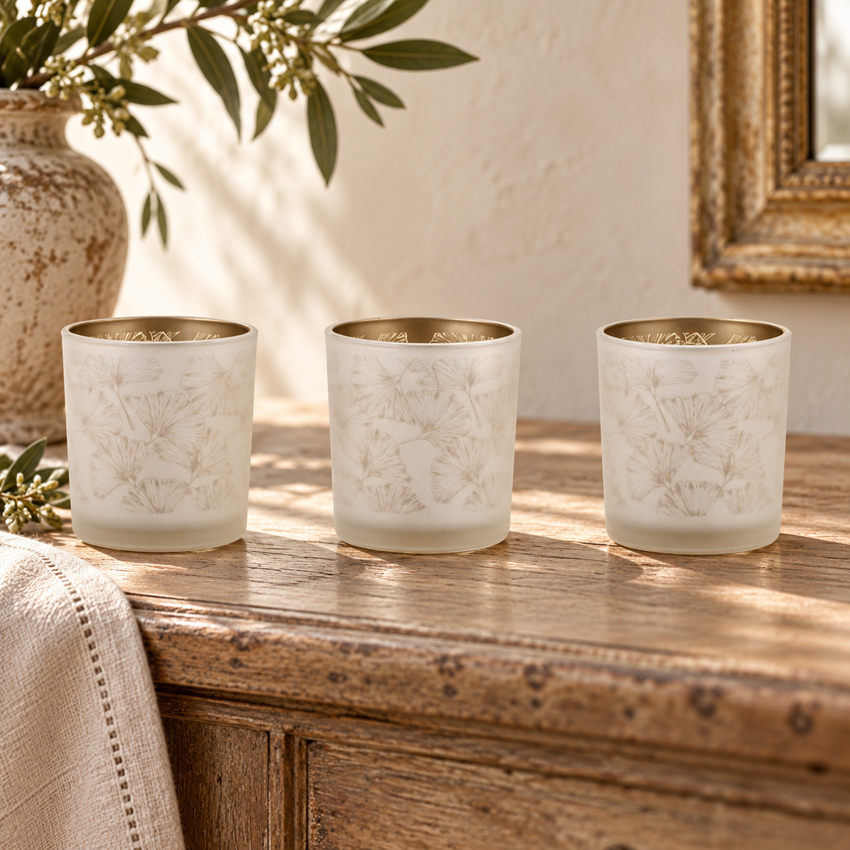 Set of 3 Silver & Gold Glass Votive Candle Holders in a styled home setting