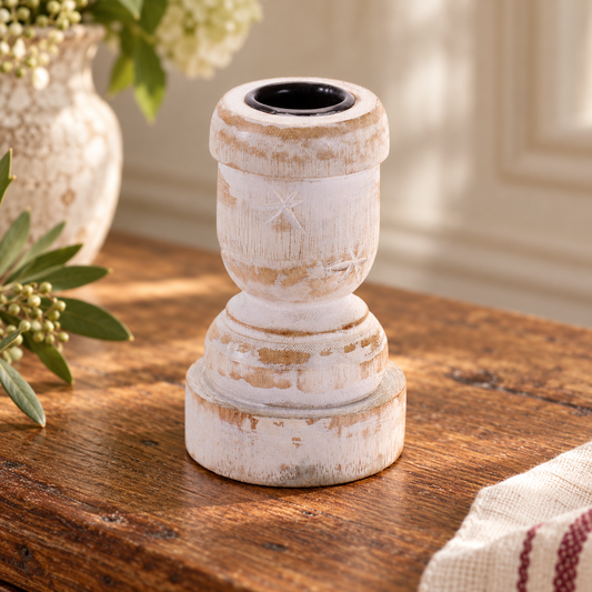 One representative white washed wood taper candle holder from the set of two matching pieces