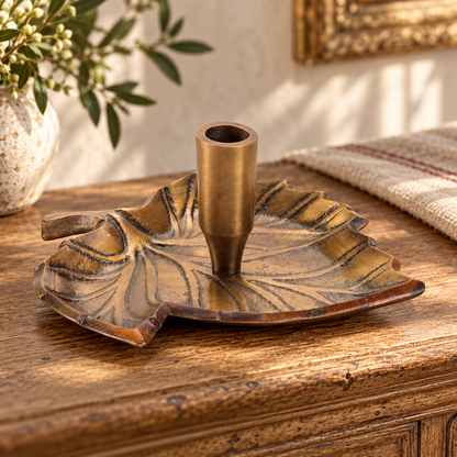 Leaf Taper Candle Holder 5.75"L x 3"H Aluminum in a styled home setting
