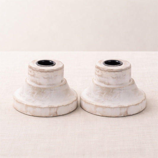 Two matching white washed wood taper candle holders; actual supplier photo